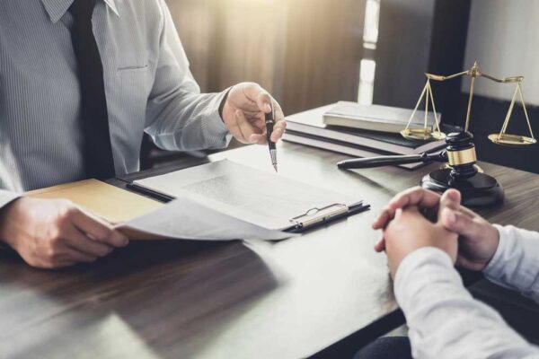 An estate attorney discusses a trust with a client