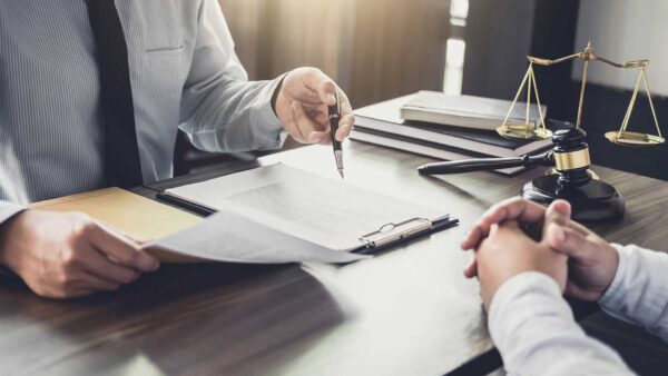 An estate attorney discuses a trust with a client