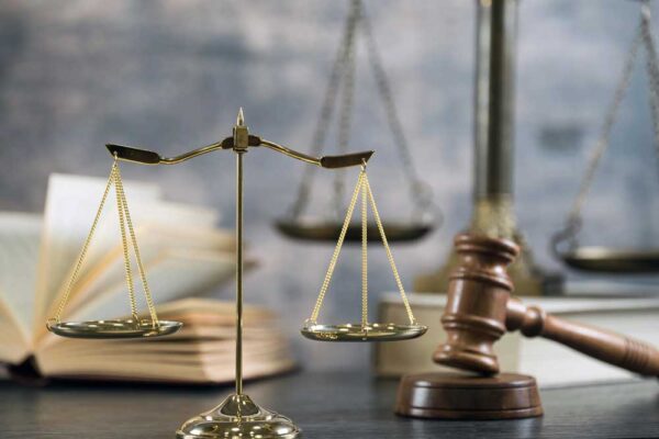 scales of justice, a gavel and a law book